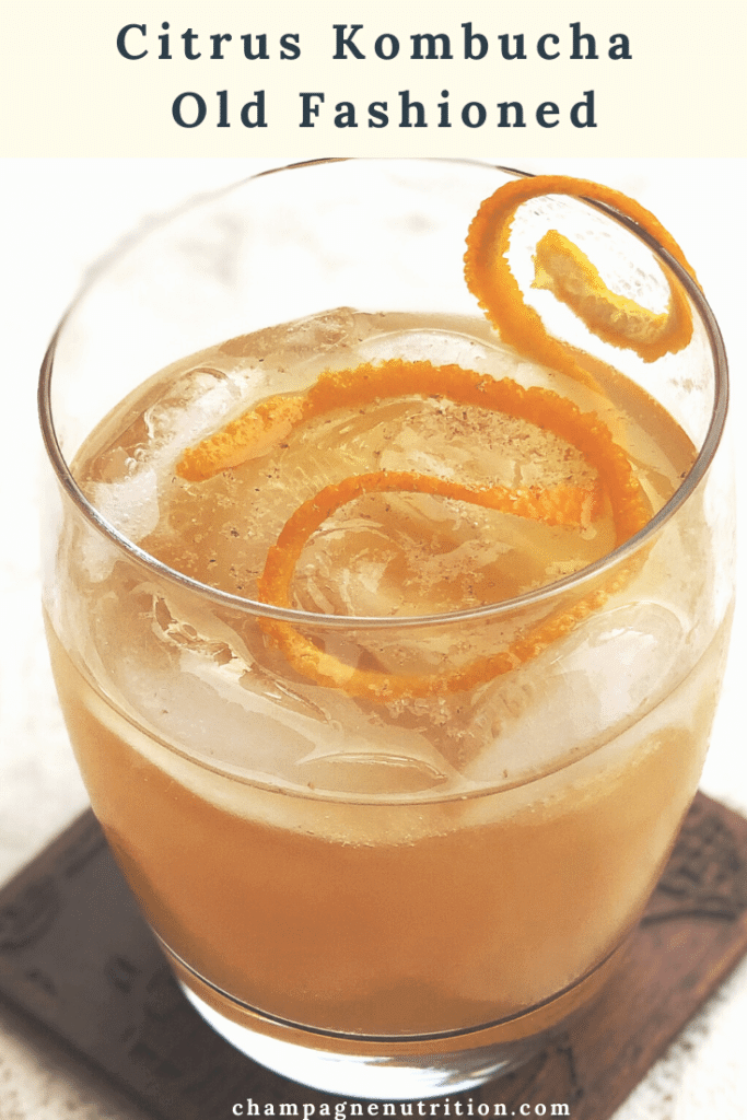 a beautiful glass of old fashioned cocktail with a twist