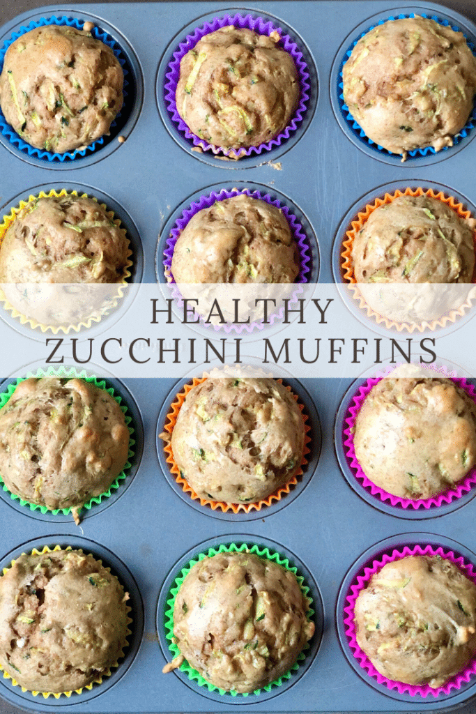 Zucchini muffins in a 12-tin with brightly colored liners