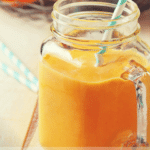 a beautiful, fall smoothie with a golden pumpkin color