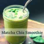 A mason jar with a deliciously green smoothie sprinkled with chia seeds with a metal straw