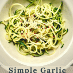 Beautiful, vibrant zucchini noodles with parmesean cheese on top