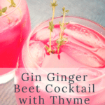 A vibrantly pink cocktail on the rocks with sprigs of thyme